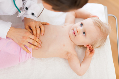 Pediatric doctor examine baby. Top view